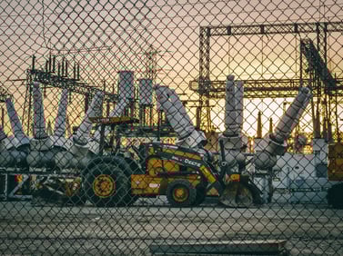 Idle construction equipment caused by a power outage, highlighting the need for incident management.