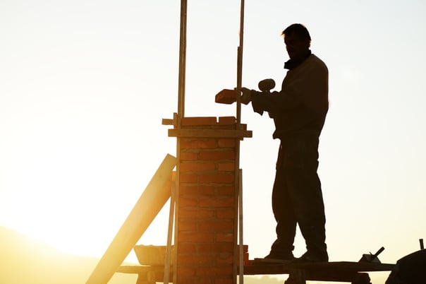 Worker ensuring compliance with safety measures as part of risk management in construction projects