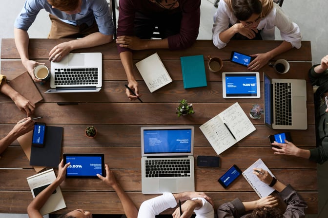 a group of people handling project management