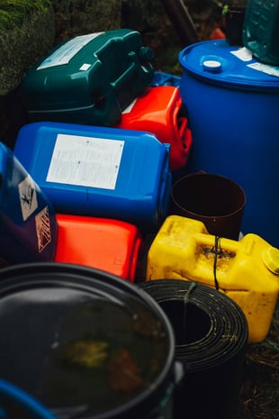Storage area containing chemical waste, requiring careful incident management.