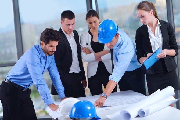 Team discusses construction risk management plan.