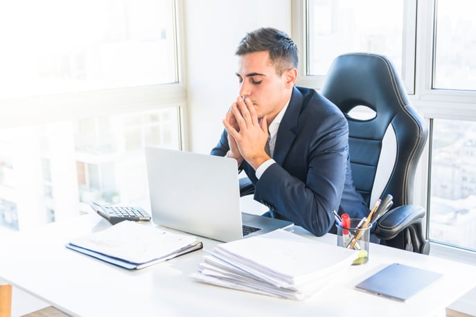 a worried young man who doesn’t know the importance of risk management