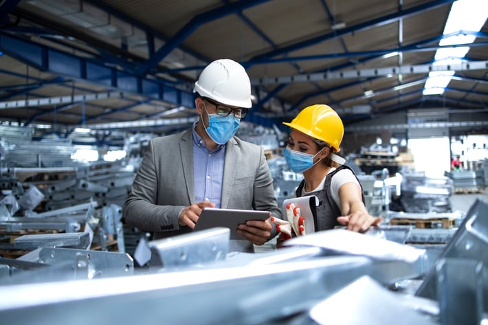  two industry workers discussing the potential operational risks