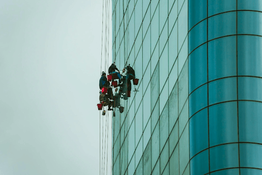 risk management KPI showcased through people cleaning a building exterior
