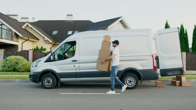  Delivery van unloading packages in a residential area, showing everyday risks in logistics industry operations 