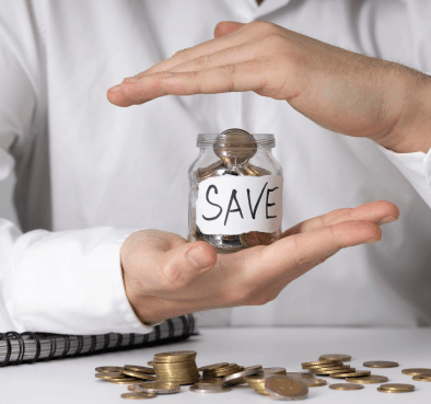 A person protecting a jar labeled 'SAVE' filled with coins, symbolizing cost savings and financial risk management in manufacturing industry