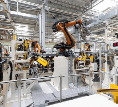 Automated machines in a modern manufacturing facility, showcasing efficiency and advanced risk management solutions in manufacturing industry