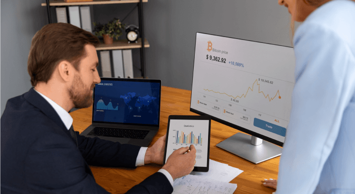 a man showing the benefits of risk management information systems to another
